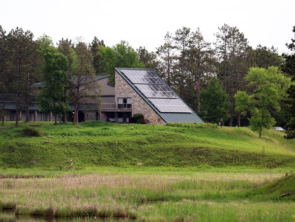 A stone building in the forest 